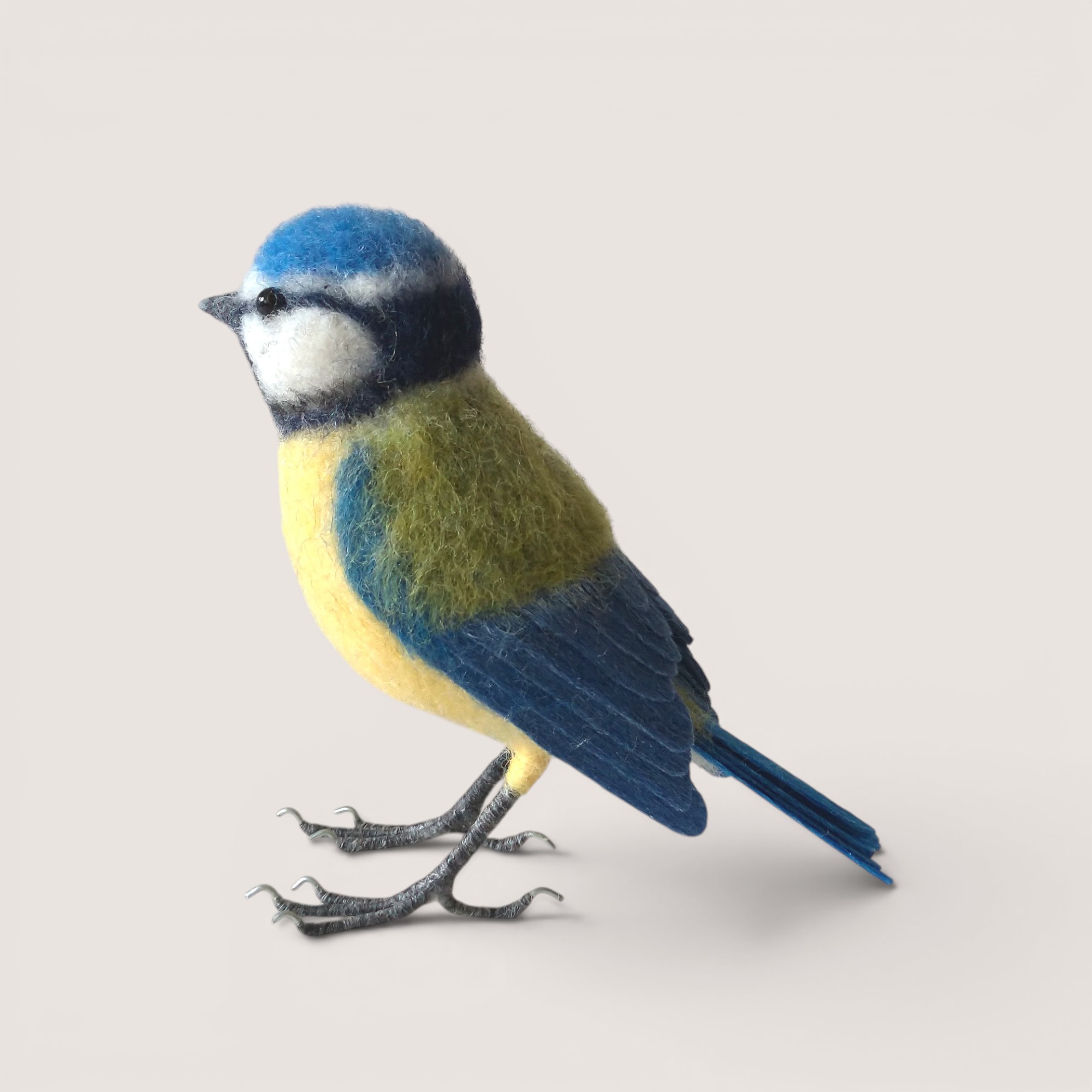 Blue Tit 2 Side view of a handmade needle felted Blue Tit by Grey Wren Studio.