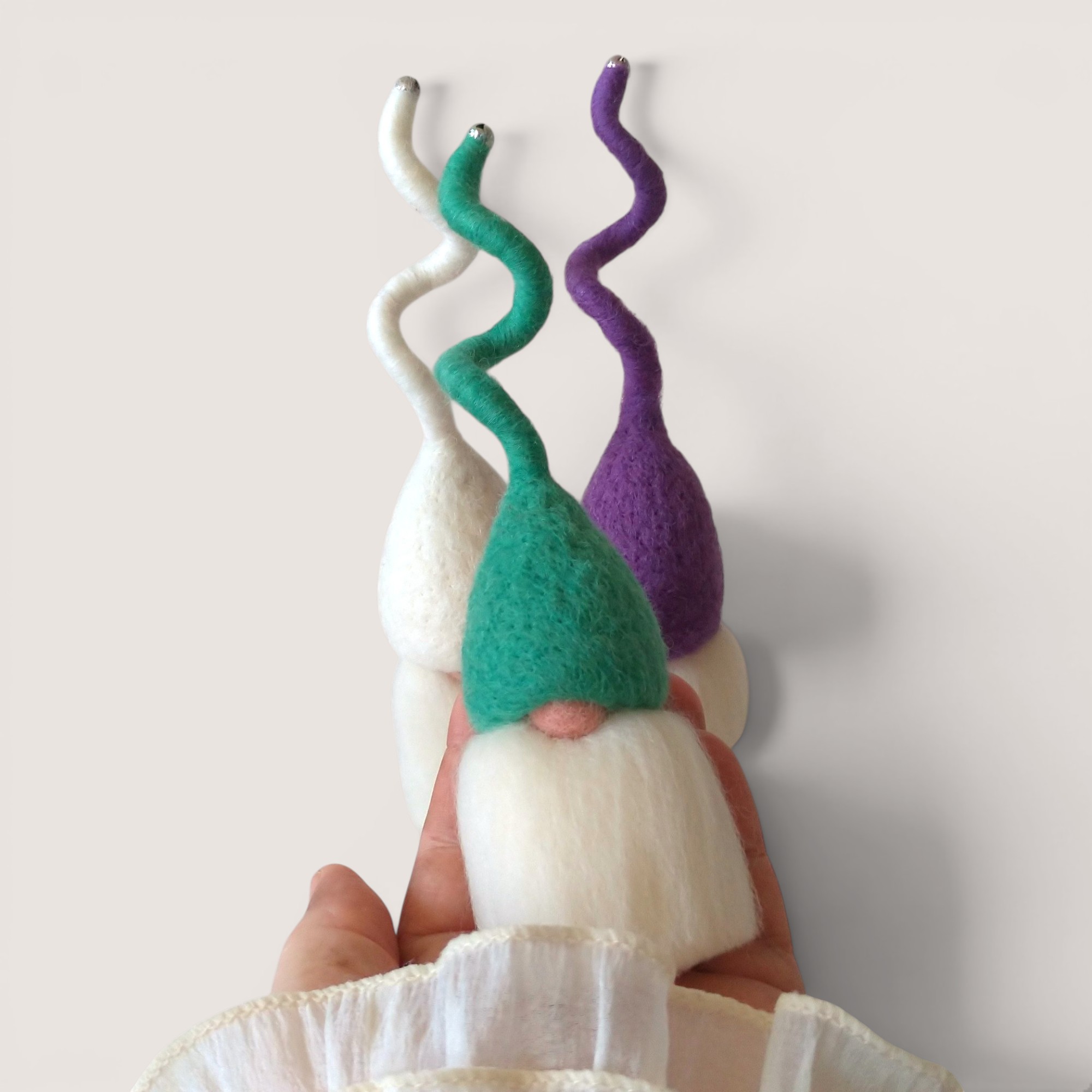 Tomten – Set of Three (Candlewick) 4 Needle felted Tomten from the Candlewick set by Grey Wren Studio held in hand to show scale.