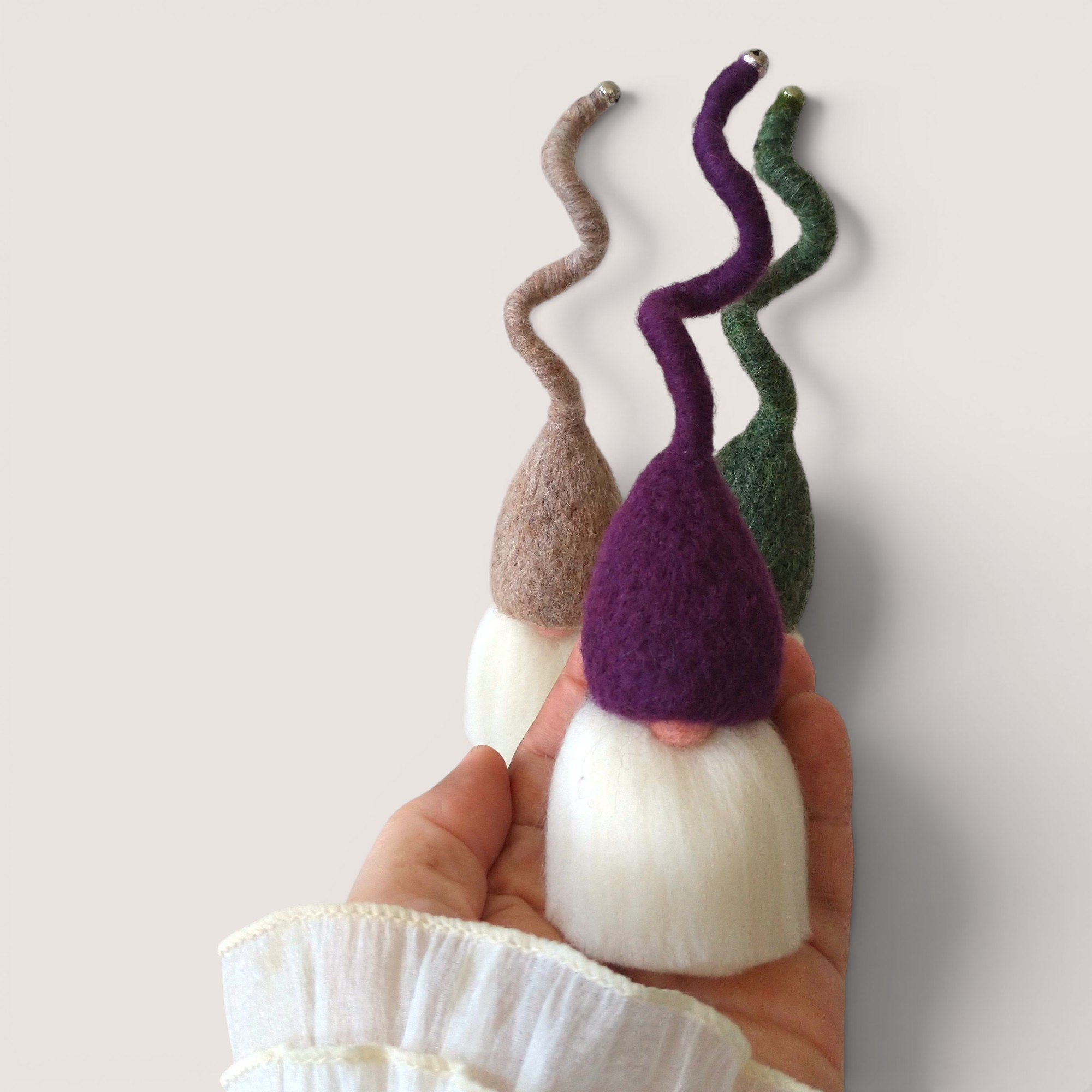 Tomten – Set of Three (Hedgerow Dusk) 4 Needle felted Tomten from the Hedgerow Dusk set by Grey Wren Studio held in hand to show scale.